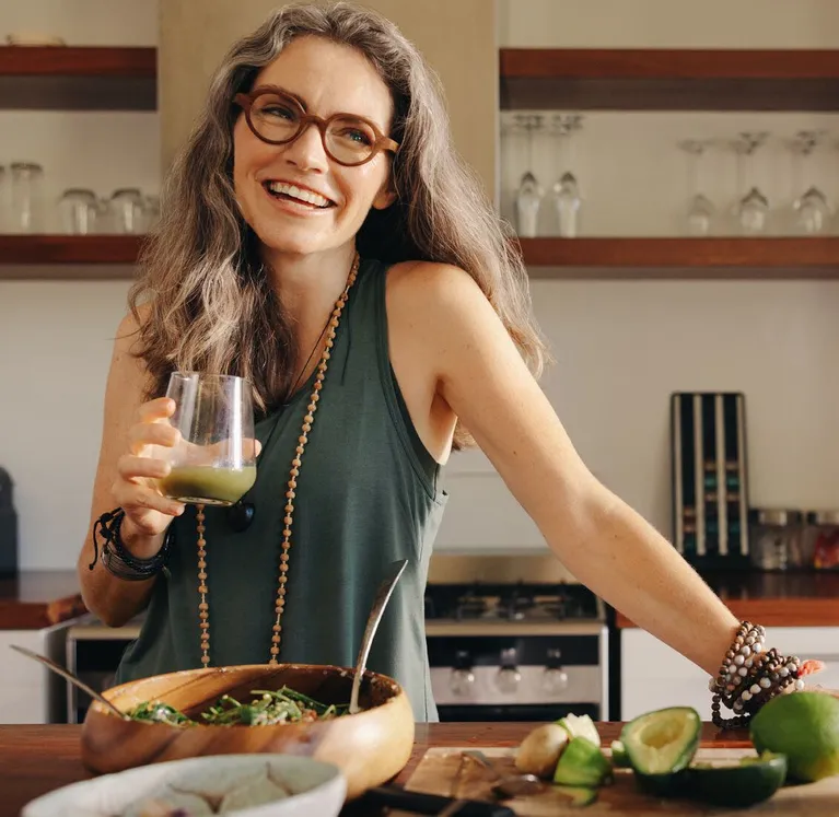 Woman preparing a nutritious meal in her kitchen